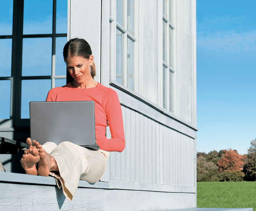 woman using laptop computer outside